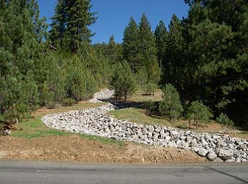 Vacant lot with rock-lined swale